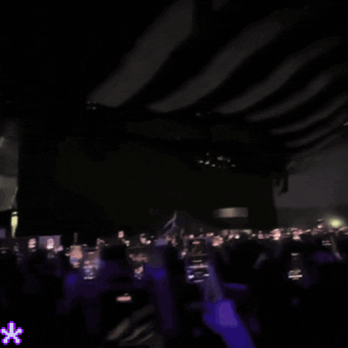 a silhouette of a woman dancing on a stage