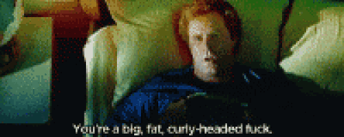 a man laying on a couch with the words " you 're a big fat curly-headed fuck " on the bottom