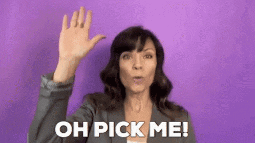 a woman is waving her hand in front of a purple background and saying `` oh pick me '' .