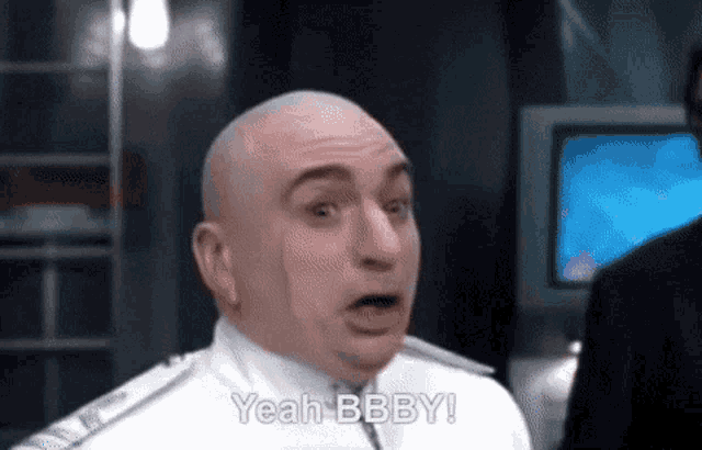 a bald man in a white uniform says yeah bbby !