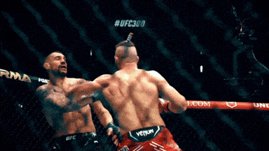 two men are fighting in a ring sponsored by bud light and vechain