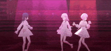 three anime girls are dancing on a stage in front of a red light .