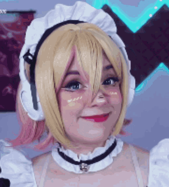 a woman wearing a maid costume and headphones smiles