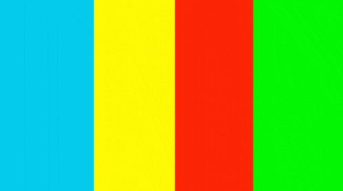 a man is sitting on the ground with his legs crossed in front of a yellow , red and green background .