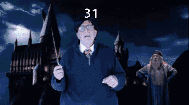 a man in a blue jacket is pointing at a blue sphere with the number 31 written on it