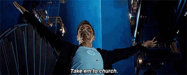 a man with his arms outstretched is saying take em to church .