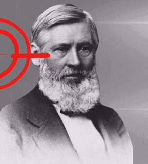 a man with a beard wearing a suit and bow tie