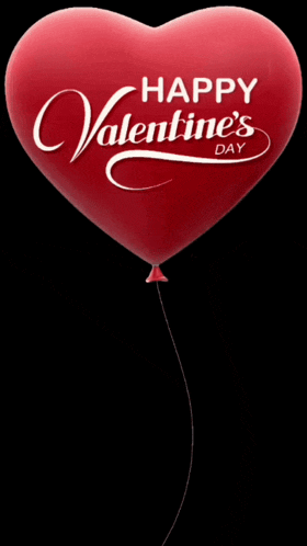 a red heart shaped balloon with the words happy valentine 's day written on it