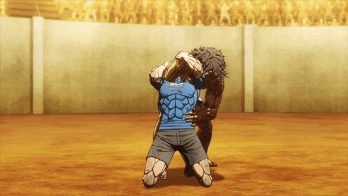 a man in a blue shirt that says ' tokyo ' on it is wrestling another man