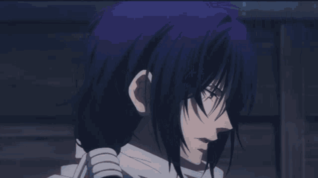 a man with long black hair is standing next to a woman