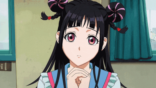 a girl with pigtails and red hearts on her hair