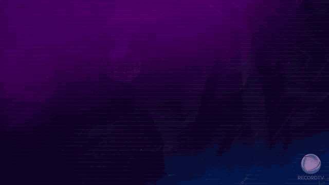 a man in a suit stands in front of a purple background that says a noite e nossa