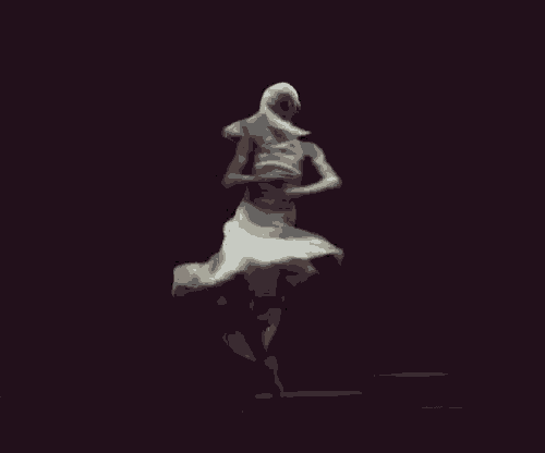 a ballerina in a white dress is dancing on a black background .