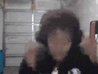 a blurry photo of a person wearing headphones