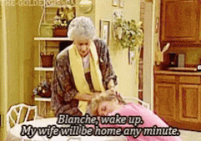 a woman is sitting at a table with another woman and says blanche wake up my wife will be home any minute .