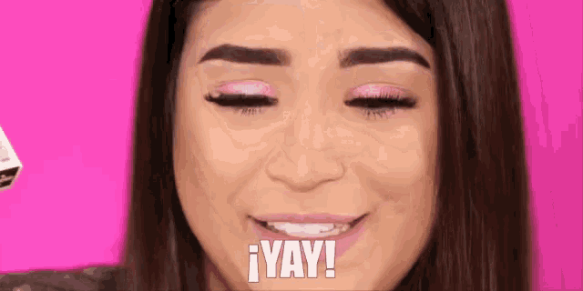 a close up of a woman 's face with the words yay written on it