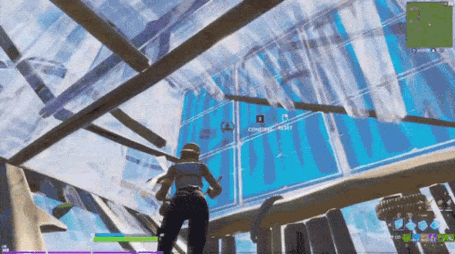 a screenshot of a video game shows a person standing in front of a screen that says ' completed ' on it