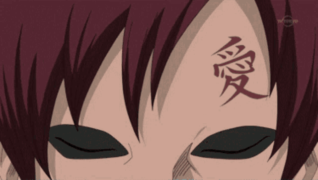 a close up of a person 's face with a chinese symbol on their forehead