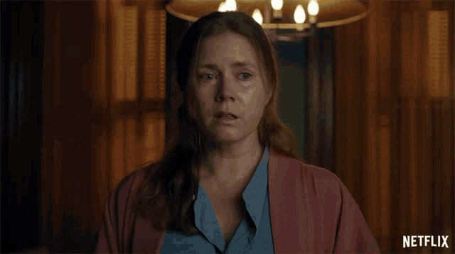 a woman with tears running down her face is shown in a netflix ad