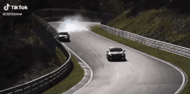 a car is driving down a track with a tiktok watermark on the bottom