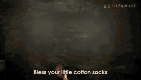 a boy in a suit and tie is dancing with the words bless your little cotton socks behind him