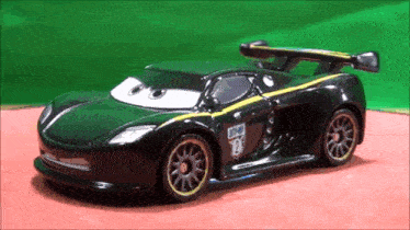 a toy car has the number 12 on the side