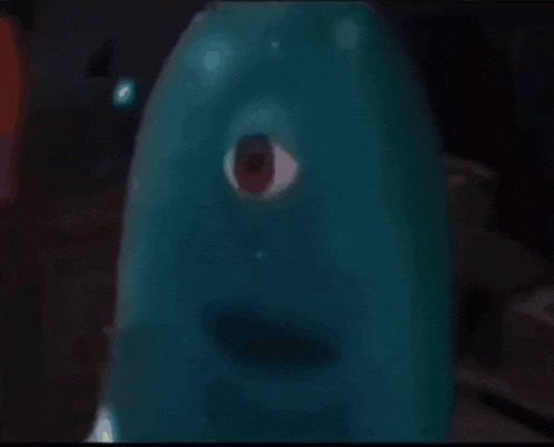 a blue balloon with a red eye is looking at the camera .