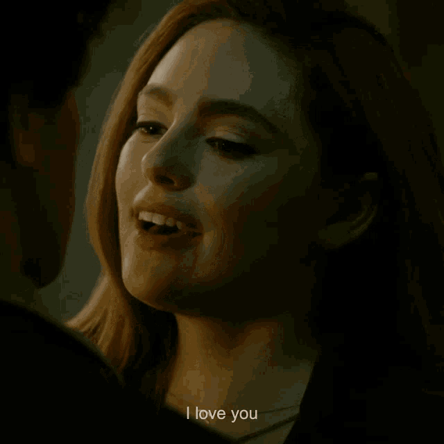a close up of a woman 's face with the words i love you next to her