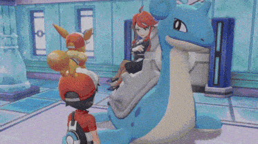 a boy in a red hat is standing next to a large blue and white pokemon