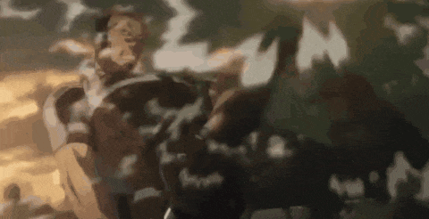 a blurred image of a man riding a horse with a shield on his back .