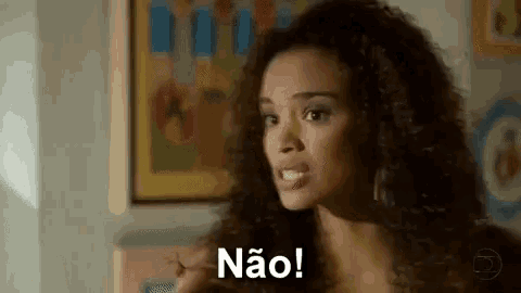 a woman with curly hair is standing in front of a painting and says não !
