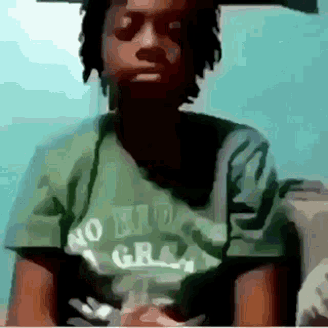 a man is wearing a green shirt that says no hiding great