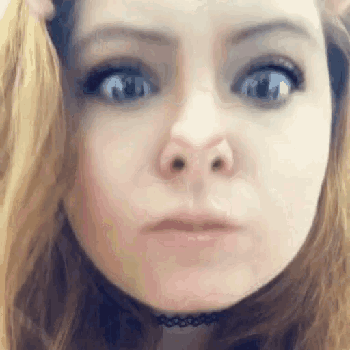 a close up of a woman 's face with a choker