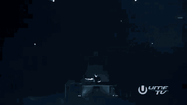 a stage with a dj and a sign that says ' ultra tv ' on it