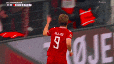 a soccer player with the number 9 on his back