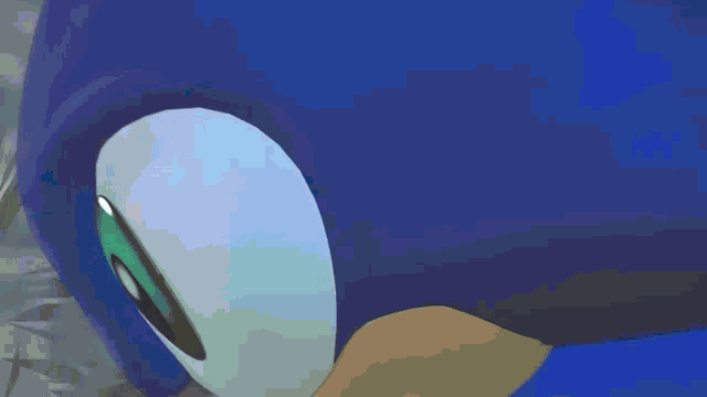 a close up of sonic the hedgehog 's eyes with a blurred background