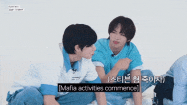 two boys are sitting next to each other with mafia activities commence written on the bottom of the screen