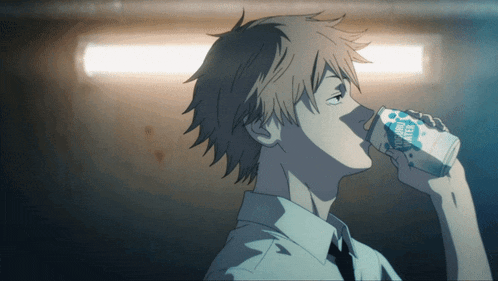 a man is drinking from a can that says yogurt