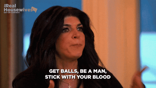 a woman says " get balls be a man stick with your blood " in front of a real housewives logo