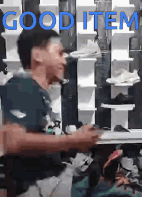 a man in a store with the words good item on the bottom right