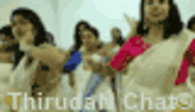 a group of women are dancing in a room with the words thirugan chats written on the bottom .