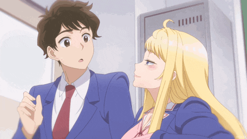 a boy and a girl are standing next to each other in a locker room