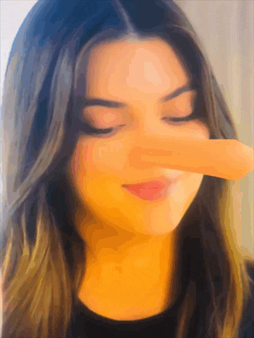 a close up of a woman with her eyes closed and a long nose