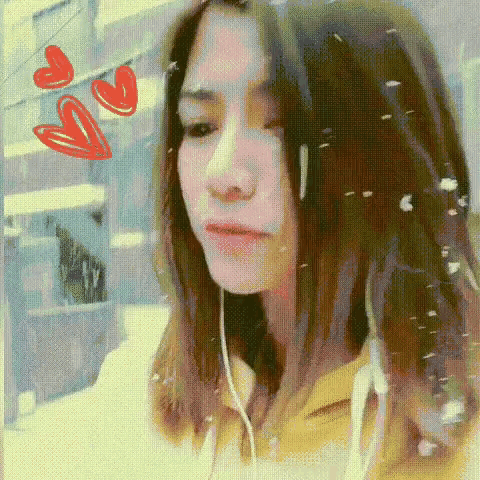 a pixelated image of a woman with hearts behind her
