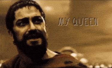 a man with a beard says my queen in front of a crowd of people