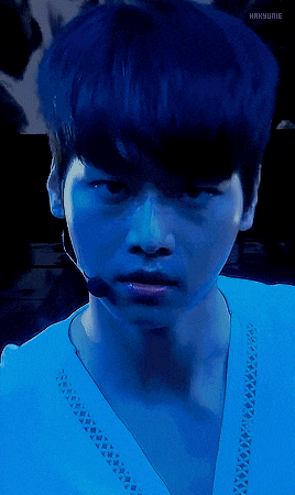 a close up of a person 's face with a blue background that says hanyunie on it