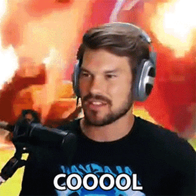 a man with a beard wearing headphones and a shirt that says coool