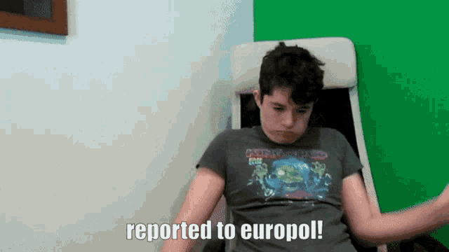 a person sitting in a chair with the words reported to europol written on the bottom