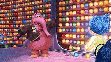 a cartoon character is standing in front of a wall of colored balls