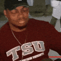 a man wearing a shirt that says tsu on it